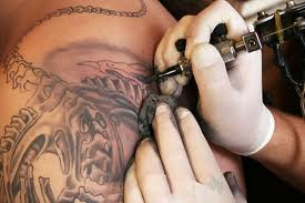 Shoulder being tattooed